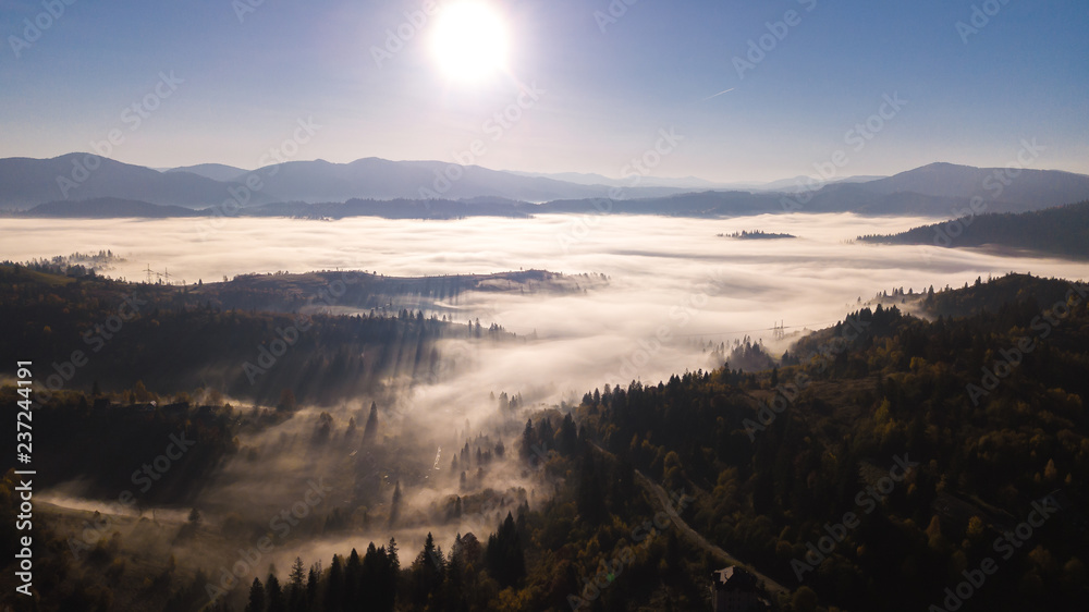 Majestic sunrise in the mountains landscape. Carpathian mountins with blue sky panoramic wiew, Ukraine.