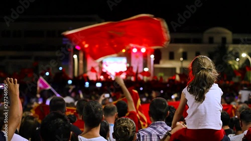 Fans celebrating the victory of their national team at the street
