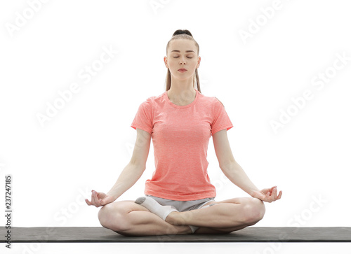 Yoga. Woman Meditating and Doing Yoga Against White background