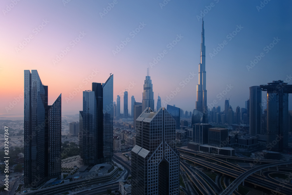 Dubai skyline in the morning, aerial top view to downtown city center landmarks at sunrise. Famous viewpoint, United Arab Emirates Dubai skyline in the morning, aerial top view to downtown city center landmarks at sunrise. Famous viewpoint, United Arab Emirates