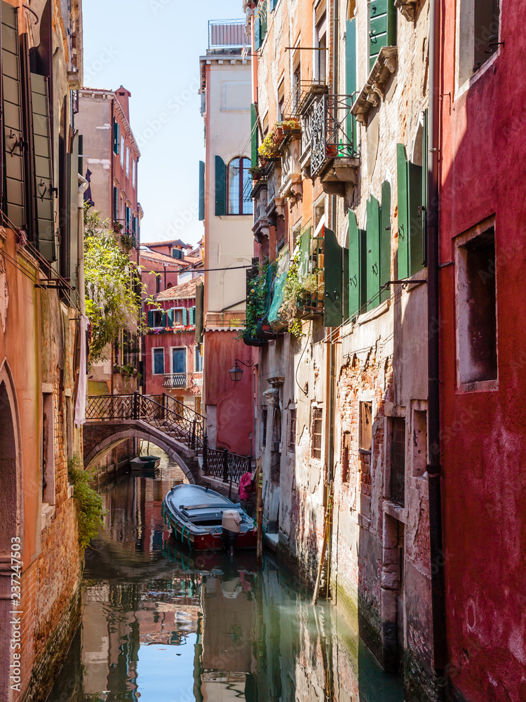 Typical canal scene in a quite and tranquil area of Venice Italy