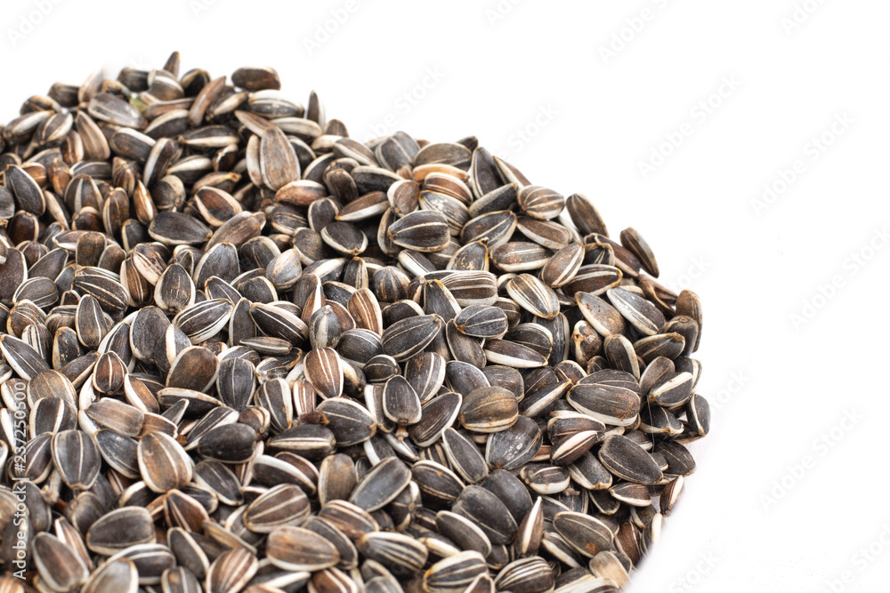 sunflower seed in heap on white background sunflower seed in heap on white background