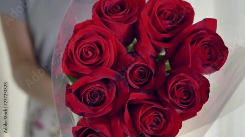 slow motion, couple give a beautiful bouquet of 9 red rose flowers for love in romantic valentine 's day