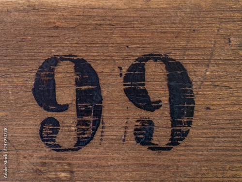 Number 99 on wooden surface photo