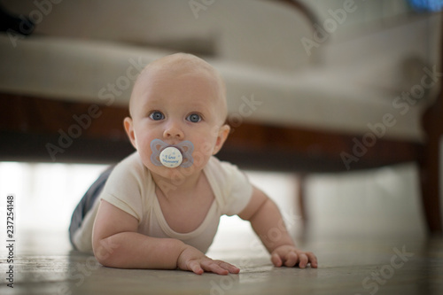 Young baby lying on his stomach. photo