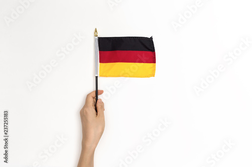 Person holding a German flag on a white background