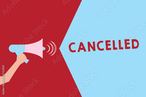 Text sign showing Cancelled. Conceptual photo decide or announce that planned event will not take place Hu analysis Hand Holding Megaphone with Sound Volume Effect icon Text Space photo
