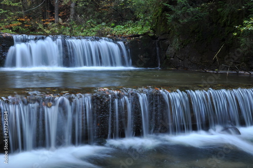 Fototapeta Naklejka Na Ścianę i Meble -  Source Vistula. Crystalline stream, clean water and waterfall