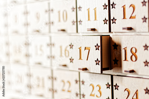 Wooden Advent calendar with little drawers with numbers photo