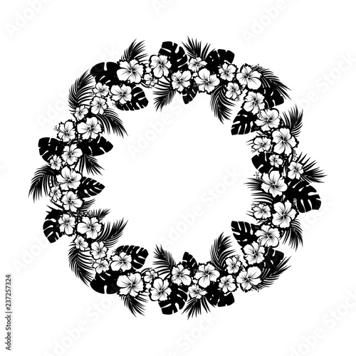 Tropical flowers and palm leaves. Frame circle