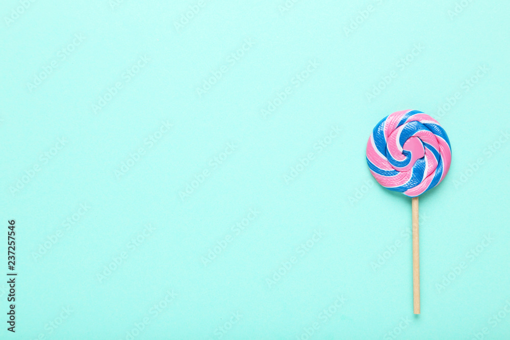 Colorful lollipop on mint background Colorful lollipop on mint background