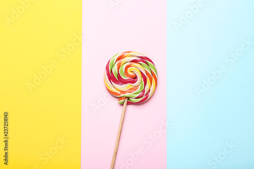 Sweet lollipop on colorful background