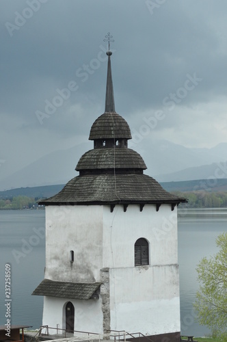 Church on the banks of the reservoir. Mara lake in Slovakia.