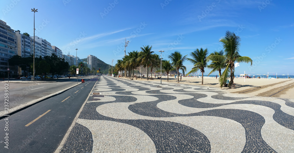 Obraz premium Copacabana Beach Rio de Janeiro boardwalk with blue sky