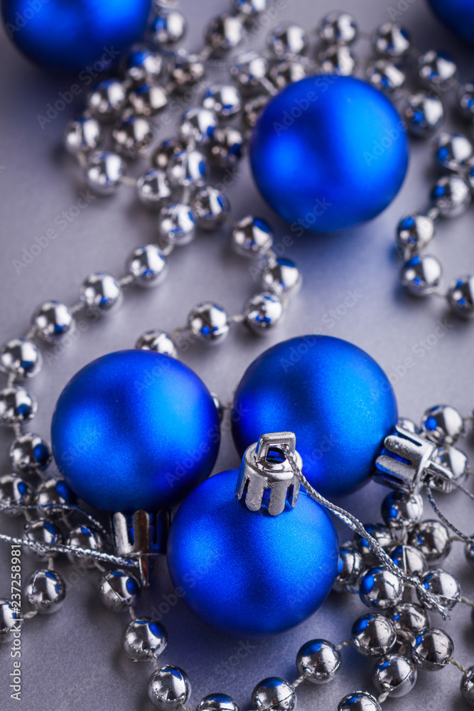 Christmas composition of Christmas tree toys on a blurred silver background Christmas composition of Christmas tree toys on a blurred silver background