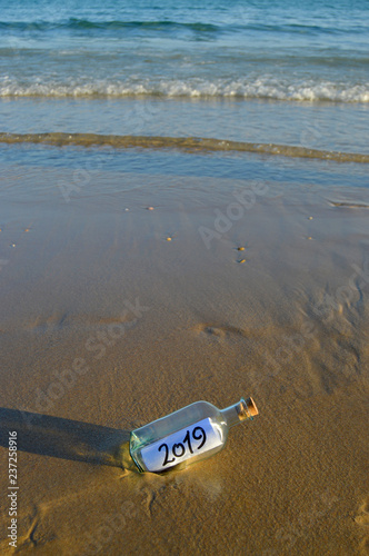 2019 summer holidays, bottle found in the sand of beach