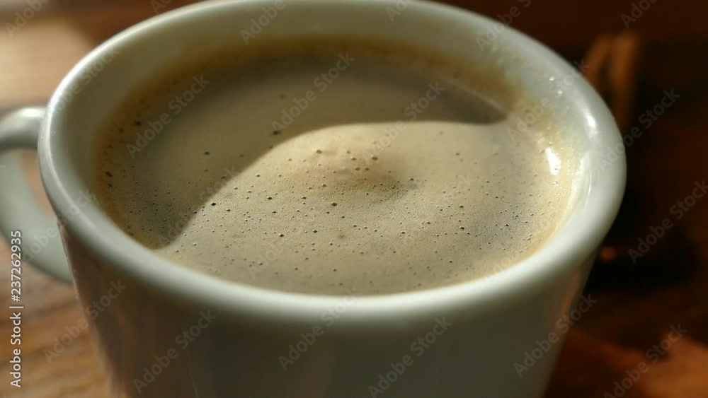 Freshly made cup of coffee. Morning refreshing drink. Coffee with foam is poured. Freshly made cup of coffee. Morning refreshing drink. Coffee with foam is poured.