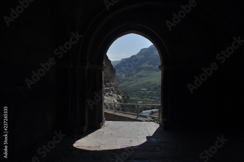 Old rock town in Vardzia, Georgia. The niches of the church and living quarters carved in a rock wall. © TRINGA