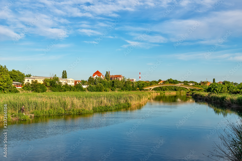 Zrenjanin, Serbia - May 17, 2018: The Begej River passes through the town of Zrenjanin. Zrenjanin, Serbia - May 17, 2018: The Begej River passes through the town of Zrenjanin.