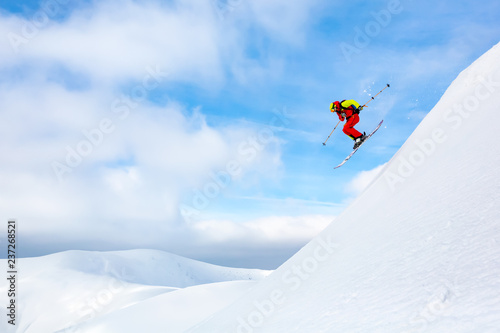 The incredible ski jumping at the blue sky background. Carpathian mountains. Winter, beautiful sunny day.