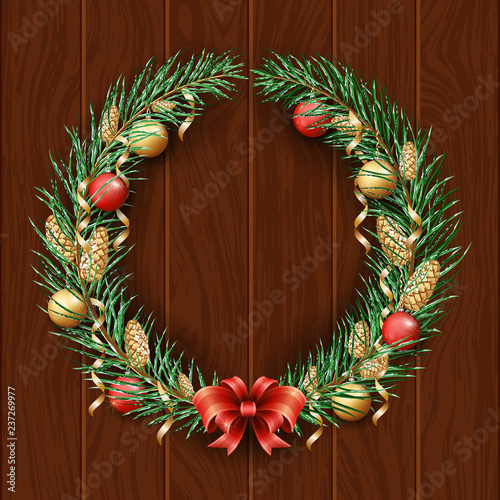 Christmas wreath border. Frame of green pine. Merry Christmas and Happy New Year 2019. Branches of a Christmas tree in the snow. Dark woody background. New Year's holiday decorations 