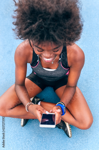 Black athlete woman on a race track photo