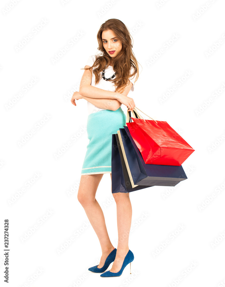 Young brunette woman with some shopping bags Young brunette woman with some shopping bags
