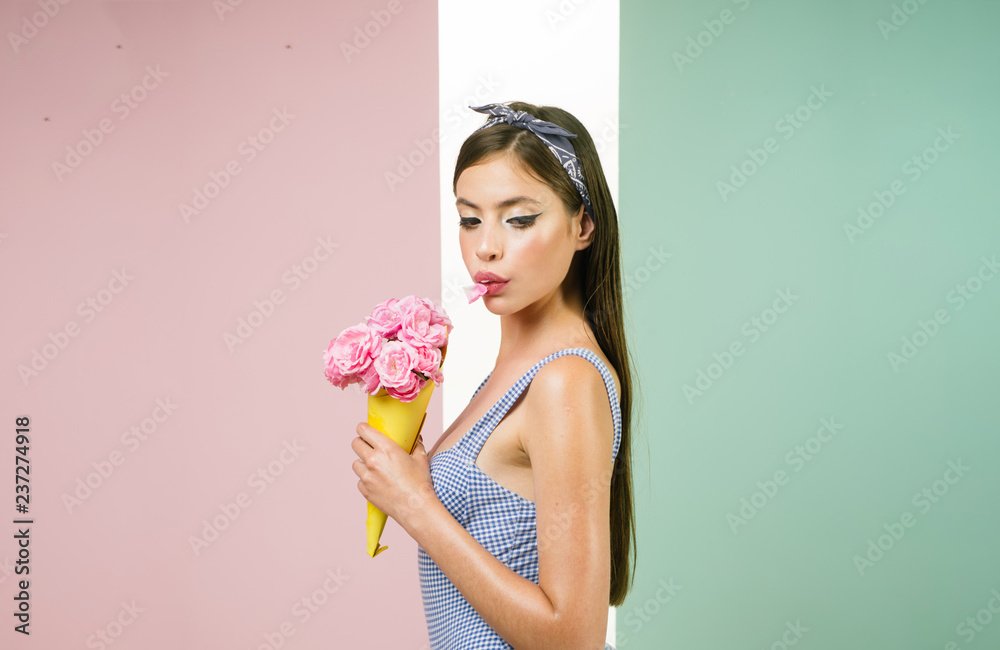 flower bouquet. Florist. Summer. pin up woman with trendy makeup. pinup girl with fashion hair. retro woman eating ice cream from flowers. pretty girl in vintage style. Enjoying hot day flower bouquet. Florist. Summer. pin up woman with trendy makeup. pinup girl with fashion hair. retro woman eating ice cream from flowers. pretty girl in vintage style. Enjoying hot day