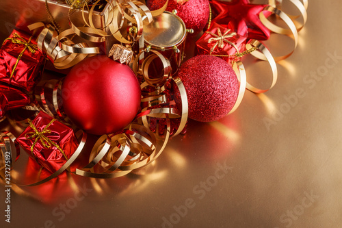 Christmas composition of Christmas tree toys on a blurred gold background