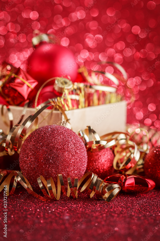 Christmas composition of Christmas tree toys on a blurred red background Christmas composition of Christmas tree toys on a blurred red background