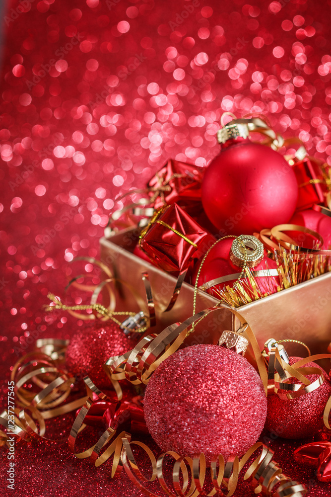 Christmas composition of Christmas tree toys on a blurred red background Christmas composition of Christmas tree toys on a blurred red background