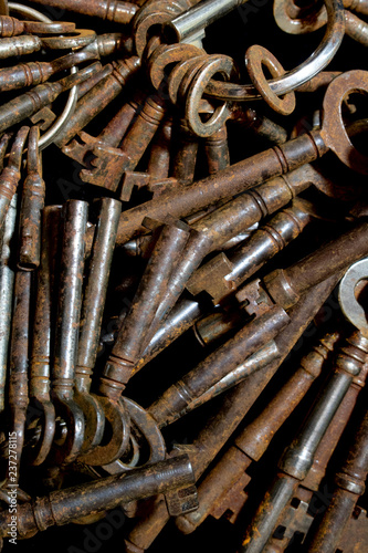 Bunch of Vintage Antique Risty Keys on Black Background