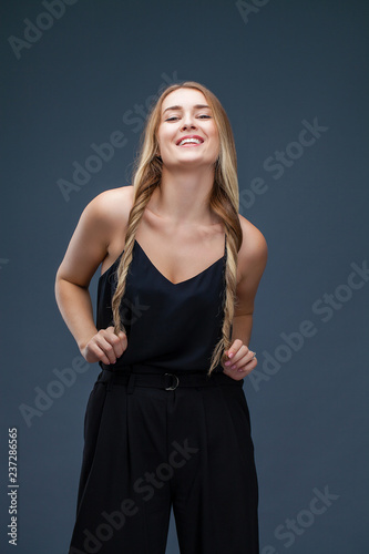 Beautiful blonde woman in black dress