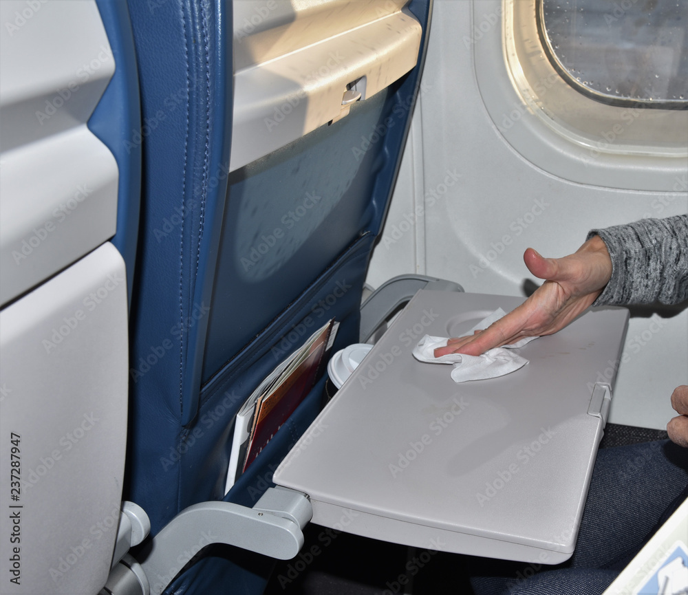 Wiping dirty airplane tray Wiping dirty airplane tray