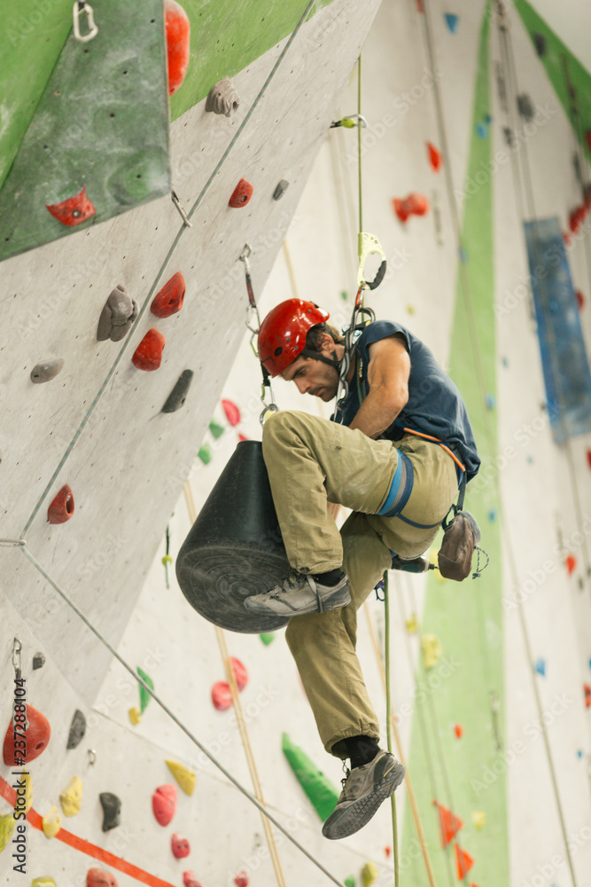 working at a climbing gym