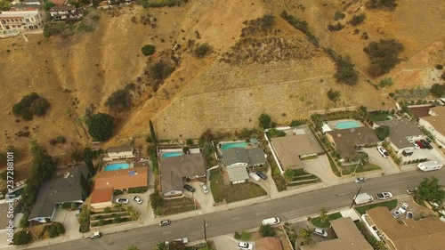 Reveal of Wildfire above neighborhood photo