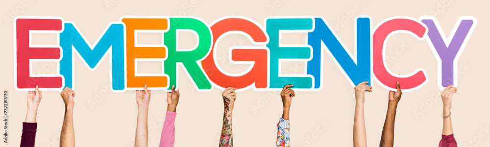 Diverse hands holding the word emergency Diverse hands holding the word emergency