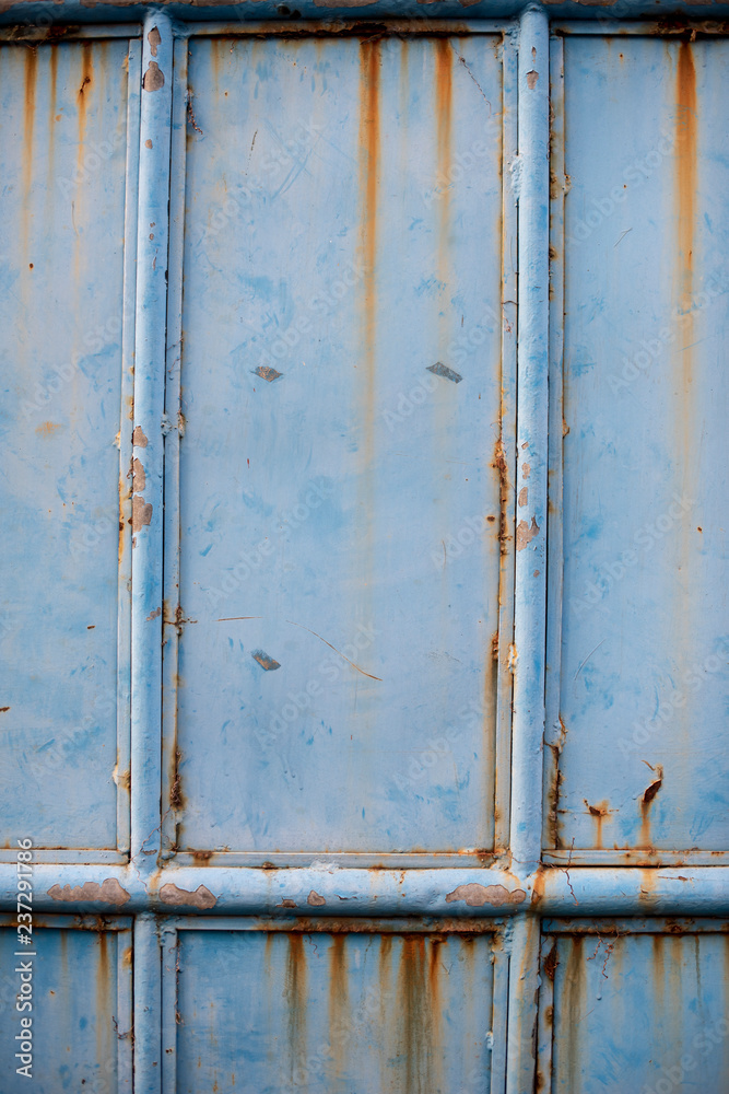 A close up of blue rustic gate with full details.