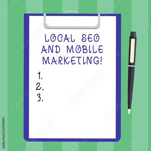 Handwriting text Local Seo And Mobile Marketing. Concept meaning Search engine optimization Digital promotion Blank Sheet of Bond Paper on Clipboard with Click Ballpoint Pen Text Space © Artur