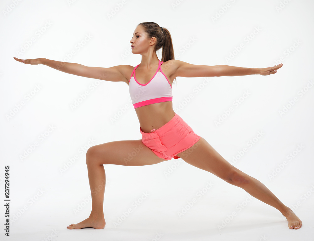 Young woman practicing yoga, working out, wearing sportswear, st Young woman practicing yoga, working out, wearing sportswear, st