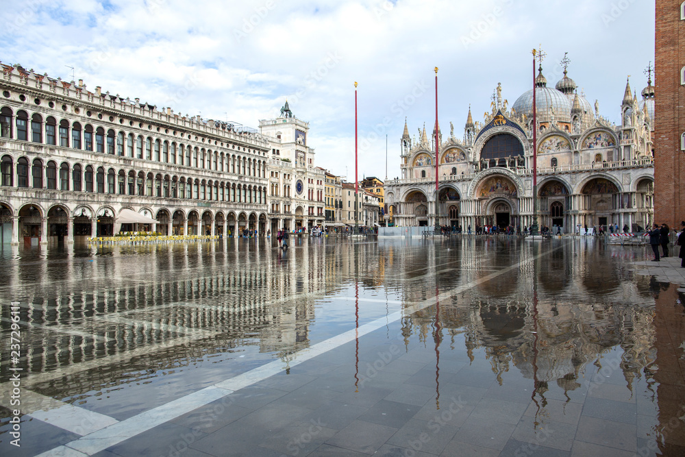 Venice, Italy - November 27, 2018: High water on St. Mark's Square in Venice. St. Marks Square (Piazza San Marco) during flood (acqua alta) in Venice, Italy