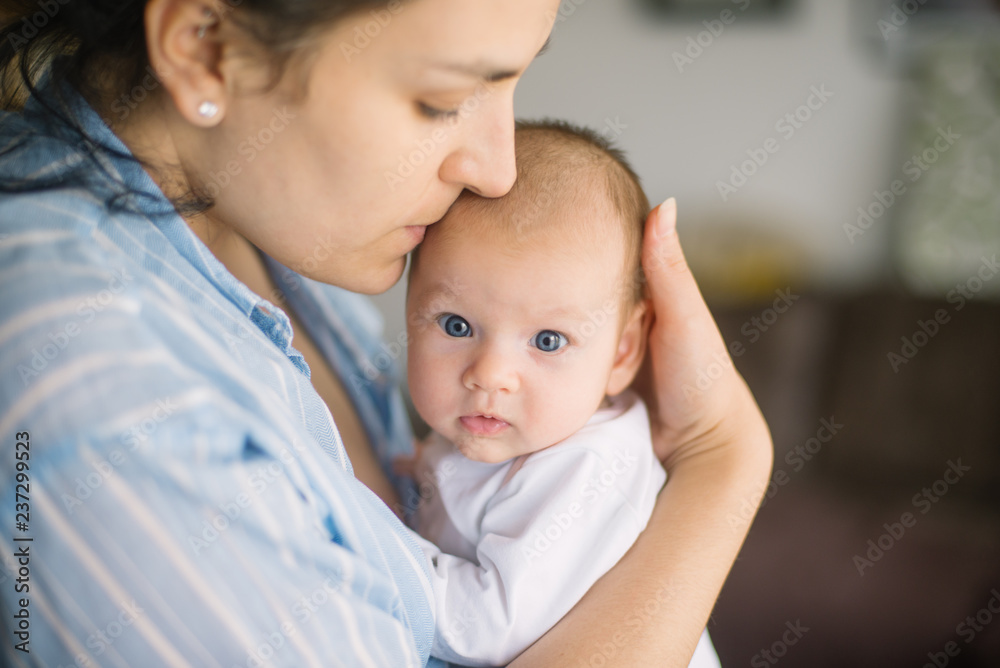mother holds her baby mother holds her baby