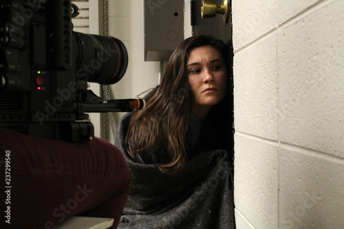 Actress on camera behind the scenes on a film or TV set