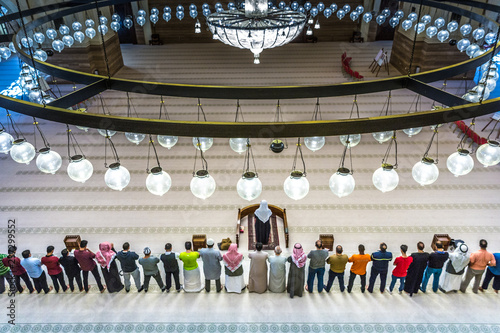 Big group of people preparing to pray at the Al-Fateh Mosque in Manama, Bahrain, one of the largest mosques in the world