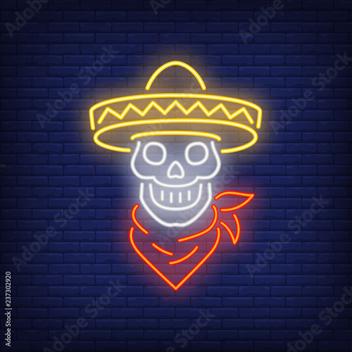 Skull in sombrero with neck scarf neon sign. Mexican culture design. Night bright neon sign, colorful billboard, light banner. Vector illustration in neon style.