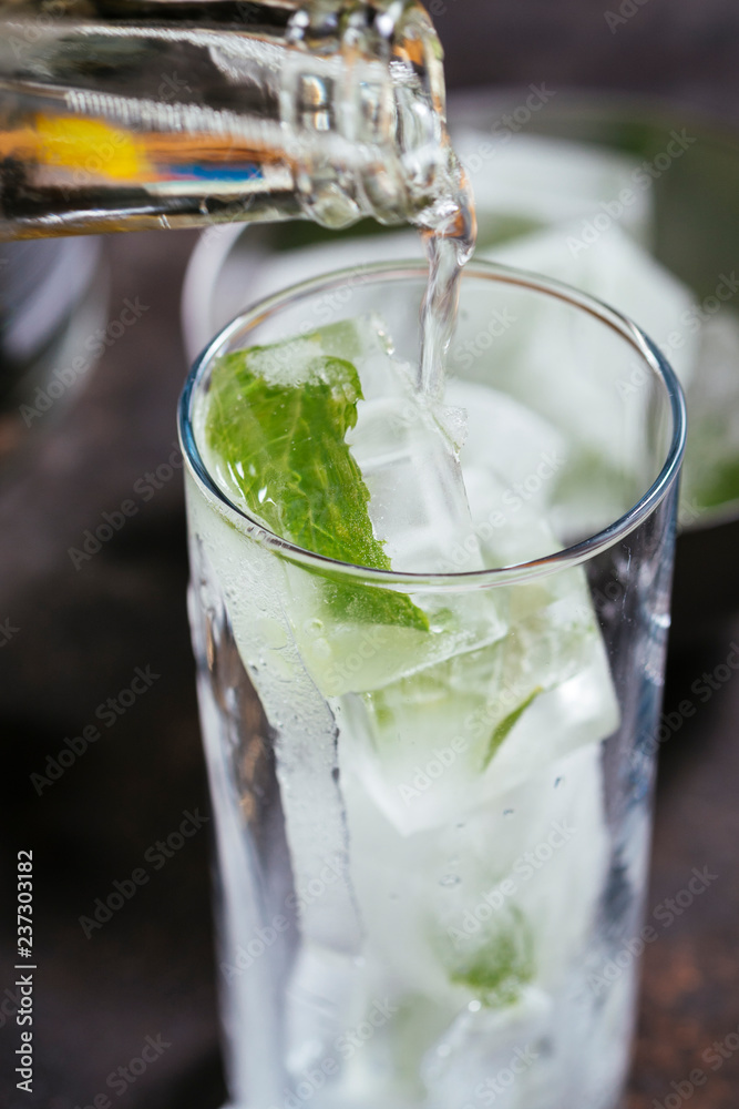 Making minty gin tonic Making minty gin tonic