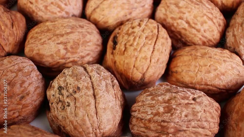 Walnut texture. Brown big whole walnuts as background. walnut nuts pattern close up photo. Walnut texture. Brown big whole walnuts as background. walnut nuts pattern close up photo.