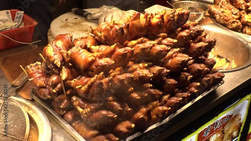 SHENZHEN, CHINA - CIRCA NOVEMBER 2018 : PIG`S FEET sold at DONG MEN FOOD STREET in Laojie area. photo