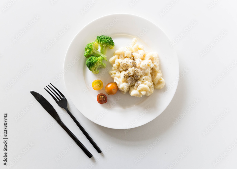 Mac and cheese styled with broccoli, vegetables and pepper Mac and cheese styled with broccoli, vegetables and pepper