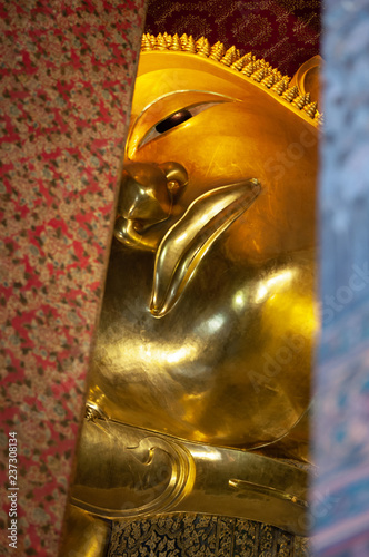 Myterious look of a Buddha sculpture's face photo